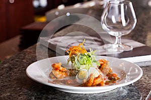 Salad with quail egg in a restaurant Still Life holiday glasses