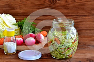 Salad of radish, carrots, cabbage, olive oil, salt and dill.