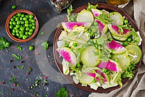 Salad from radish, cucumber and lettuce leaves. Vegan food. Dietary menu.