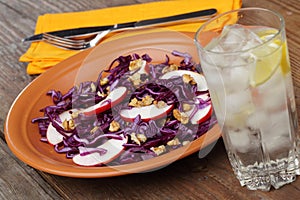 Salad with red cabbage, apples, and walnuts