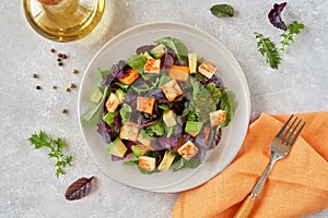 Salad with roast pumpkin , grilled halloumi and avocado