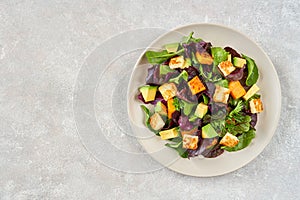 Salad with roast pumpkin , grilled halloumi and avocado,Top view with copy space