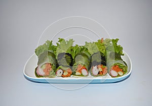 Salad roll in blue dish