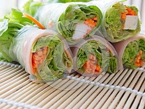 Salad roll includes fresh vegetables, carrots, crab sticks on bamboo slices, woven in clean food concept, healthy And weight contr