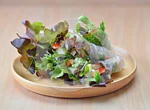 Salad rool healthy food on wooden plate