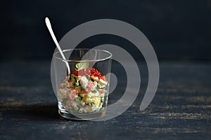 Salad with salmon and red caviar