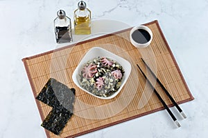 Salad from sea cabbage chuka, octopus