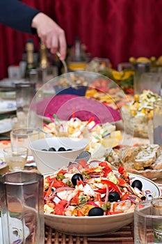 Salad from seafoods with olives and vegetables