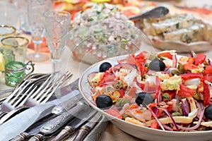 Salad from seafoods with olives and vegetables