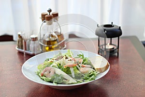 Salad with shrimps, parmesan and olive oil