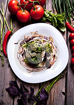 Salad of shrimps and seafood with parmesan cheese dish on rustic wooden background