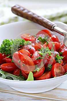 Salad of small cherry tomatoes with parsley