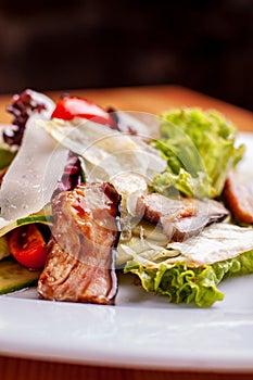 Salad with smoked catfish, carrots and miso dressing.The work of a professional chef. Dish from a restaurant Close-up