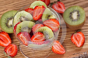 Salad with strawberries and kiwi fruit.