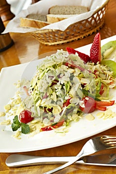 Salad with strawberry, kiwi and almond petals