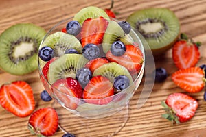 Salad with strawberry kiwi and blueberries.