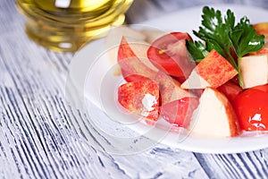 Salad tomato and apples. Vegan diet.