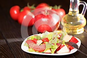 Salad tomato and apples. Vegan diet.