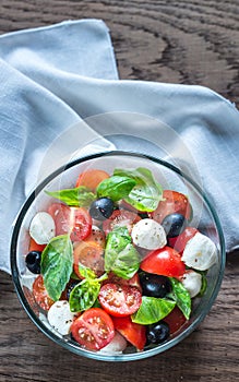 Salad with tomatoes, olives, mozzarella and basil