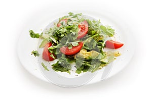 Salad with tomatoes, parsley, avocado on white background
