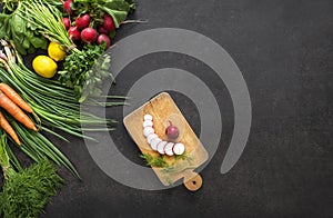 Salad vegetable concept with cutting board on rustic background, organic fresh and raw green vegetables