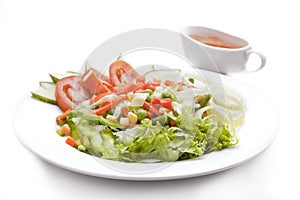 Salad. Vegetable salad consists of lettuce, long beans, peas, corn kernels, carrots, onions, tomatoes and cucumbers