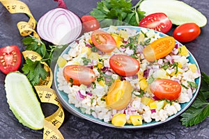 Salad with vegetables and bulgur groats and tape measure. Healthy meal containing natural vitamins and minerals