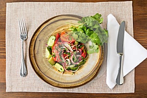 salad with vegetables and greens on table