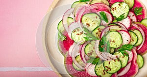 Salad with watermelon radish, cucumber and red onion