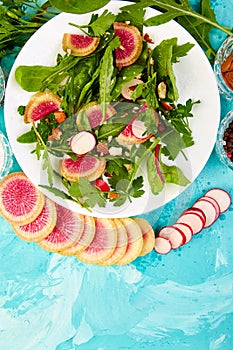 Salad in white plate around Ingredient