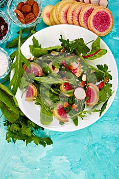 Salad in white plate around Ingredient