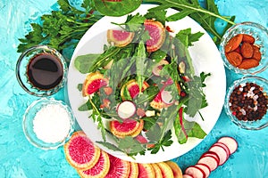 Salad in white plate around Ingredient mix leaf radish