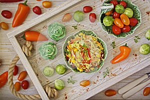 Salad of young cabbage with peppers and corn