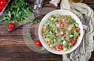 Salads with quinoa, arugula, radish, tomatoes and cucumber