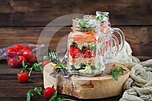 Salads with quinoa, arugula, radish, tomatoes and cucumber