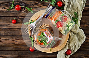 Salads with quinoa, arugula, radish, tomatoes and cucumber