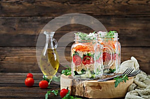 Salads with quinoa, arugula, radish, tomatoes and cucumber