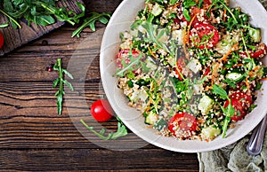 Salads with quinoa, arugula, radish, tomatoes and cucumber