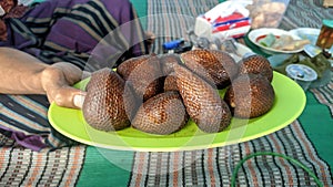 Salak fruit or snakefruit neatly arranged on a plate