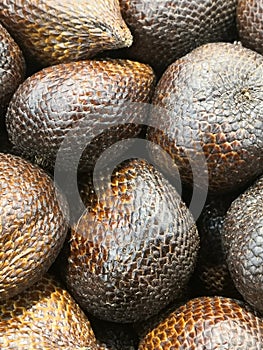 salak, a scaly-skinned fruit with sweet, sour and astringent flesh