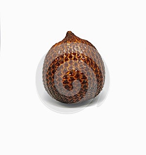 a salak (snakefruit) still wrapped in its skin isolated on a white background in the studio