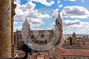 Salamanca Cathedral (Catedral Nueva) and Patio de Esculeas Mayores seen from La ClereciÂ­a church tower, Spain. photo