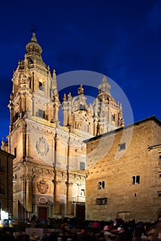 Salamanca cityscape at twilight with central square, Casa de las Conchas and La Clerecia photo