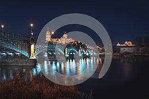 Salamanca Skyline view with Cathedral and Enrique Estevan Bridge from Tormes River at night - Salamanca, Castile and Leon, Spain photo