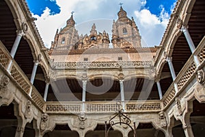 Amazing ornamented cloister view inside at the Casa de las Conchas building and La Clerecia building, Pontifical university at photo