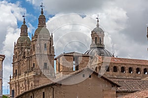 View at the baroque iconic top front facade and cdome copula at the La ClerecÃÂ­a building, Pontifical university at Salamanca photo