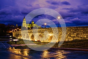 Salamanca sunset in roman bridge Tormes river