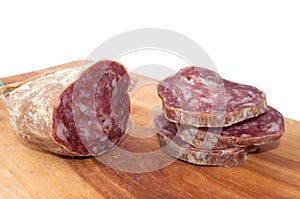 Salami and slices on wood trencher