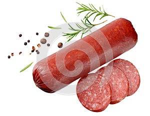 Salami smoked sausage with slices, rosemary and peppercorns isolated on white background. top view