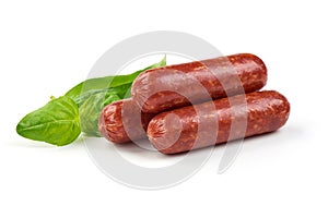 Salami smoked sausages with herbs isolated on white background